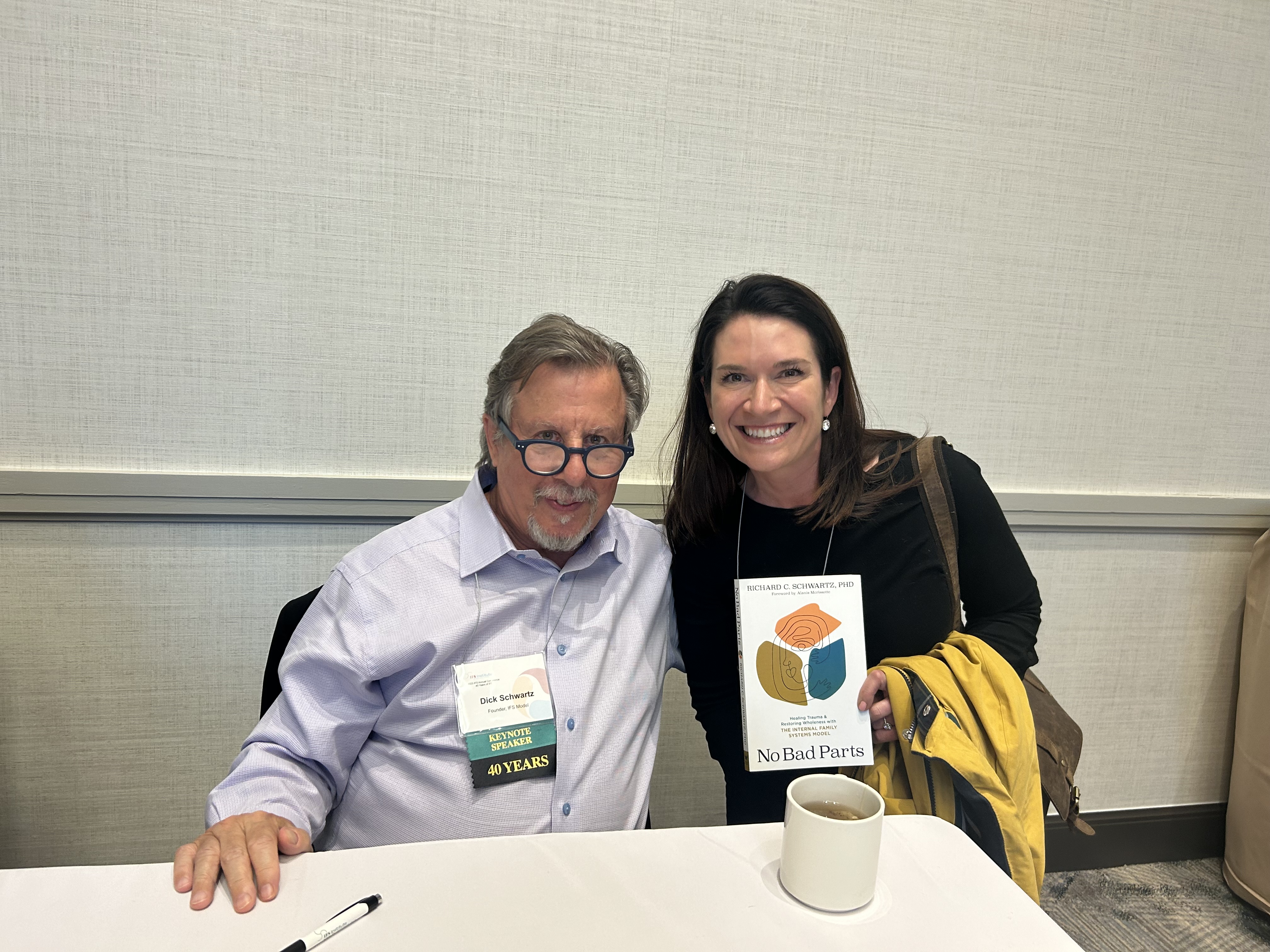 Alecia Zunker with Dick Schwartz, founder of Internal Family Systems therapy, holding No Bad Parts
